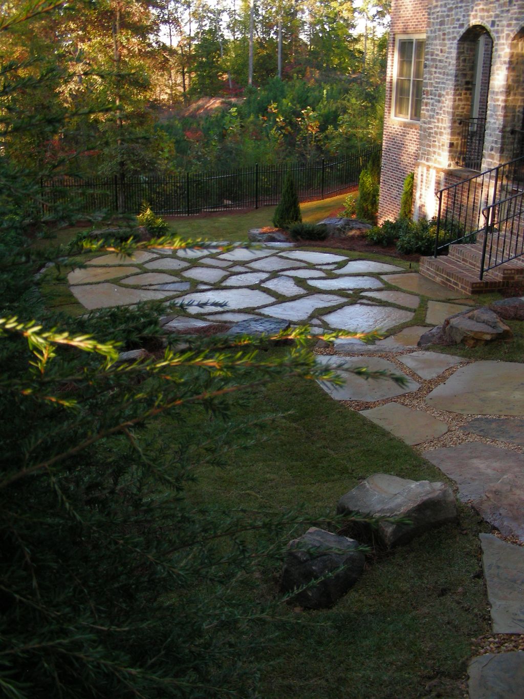 Natural stone pathways and patio, with boulders an
