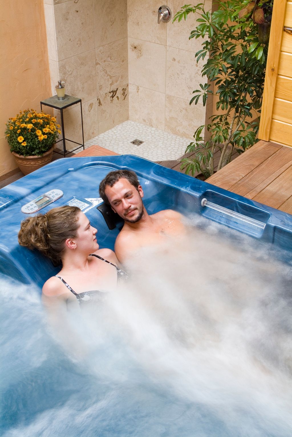 Couple relaxing in the outdoor garden Air Room hot