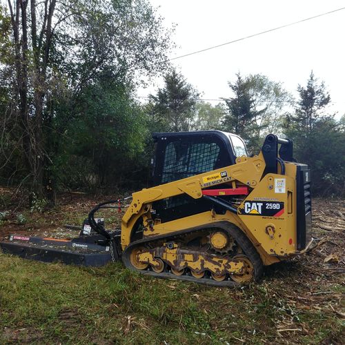 R&H Tractor Services uses a CAT 259D to clear this