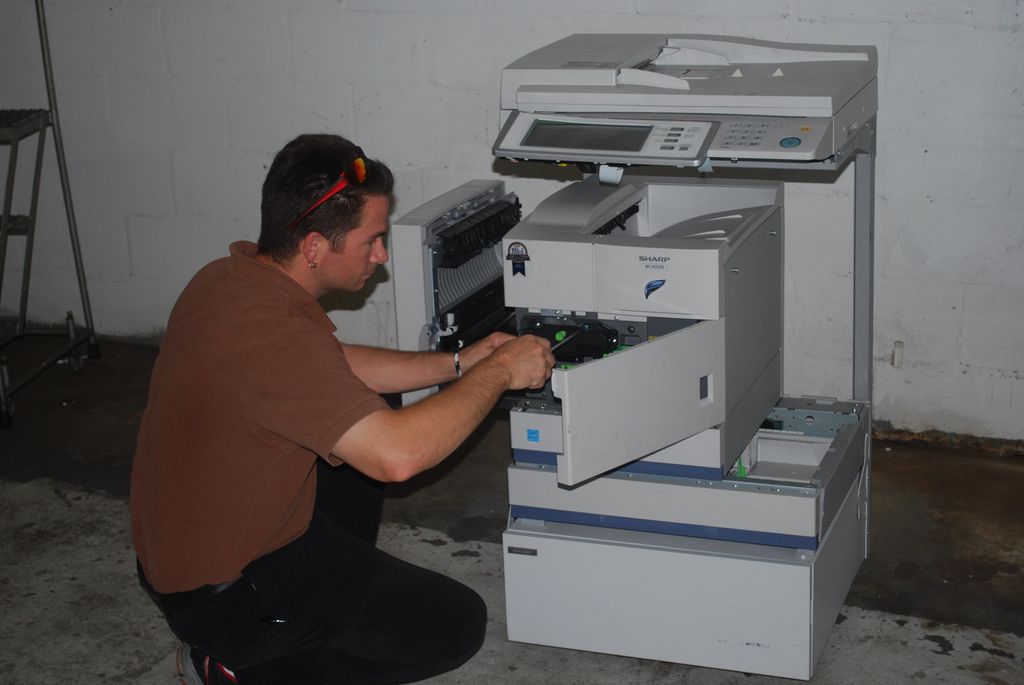 Our Tech working on a copier