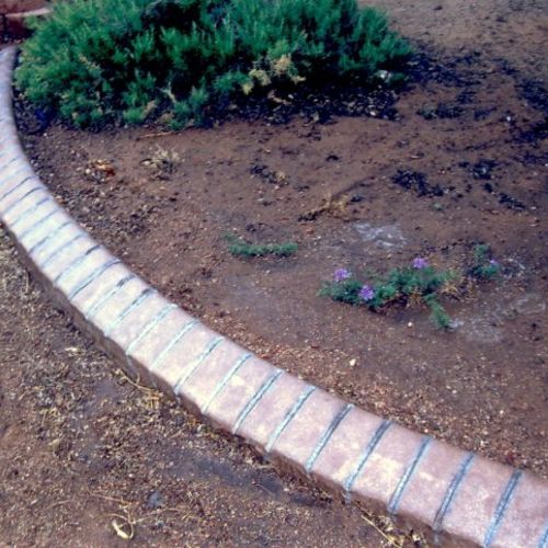 Decorative curbing for separation between planters