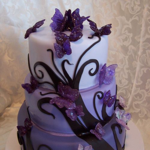 Wedding cake with fondant and edible butterflies.
