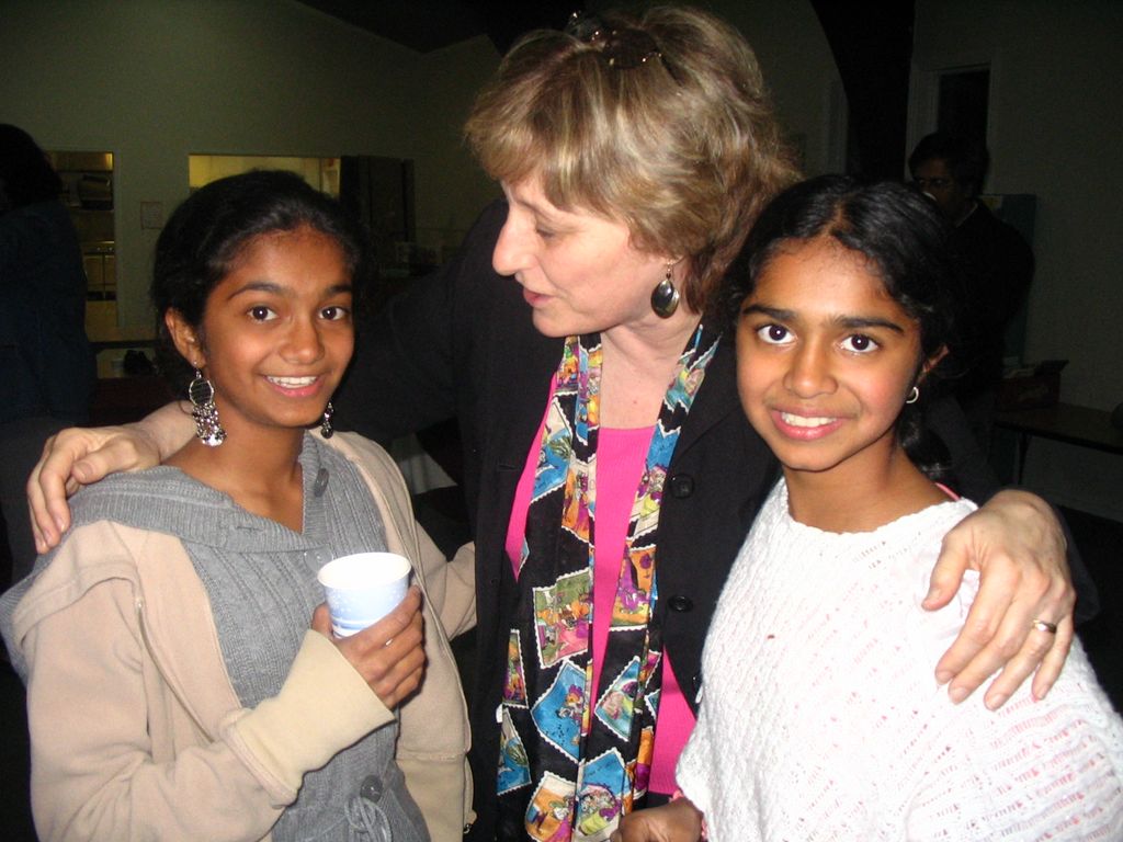 Director encourages performers at reception after 