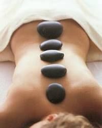 A hot stone massage helps to penetrate heat deep i