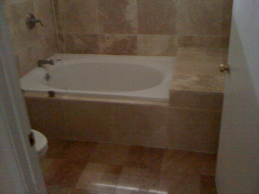 Here is the finished tub. New marble tile and deep