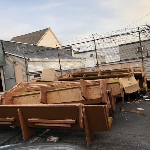 Pews to  be cut into pieces and taken to the dump