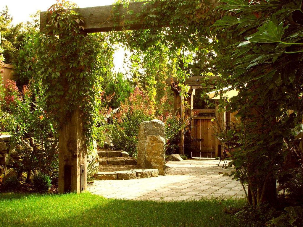Arbors create doorways into other rooms of the yar
