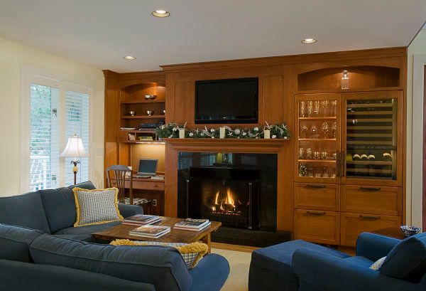 Traditional style desk, fireplace and dry bar area