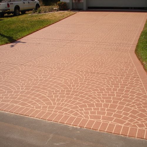 Driveway spray texture with paver pattern.