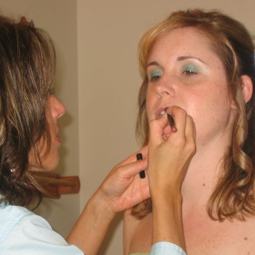Make-up touch ups on site at a wedding