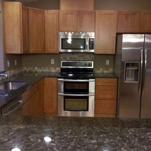 Custom cabinets and granite are standard in ever h