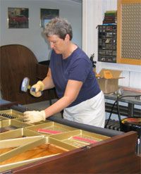 Stringing a grand piano