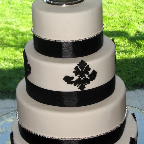 Tiered wedding cake with fondant design and diamon