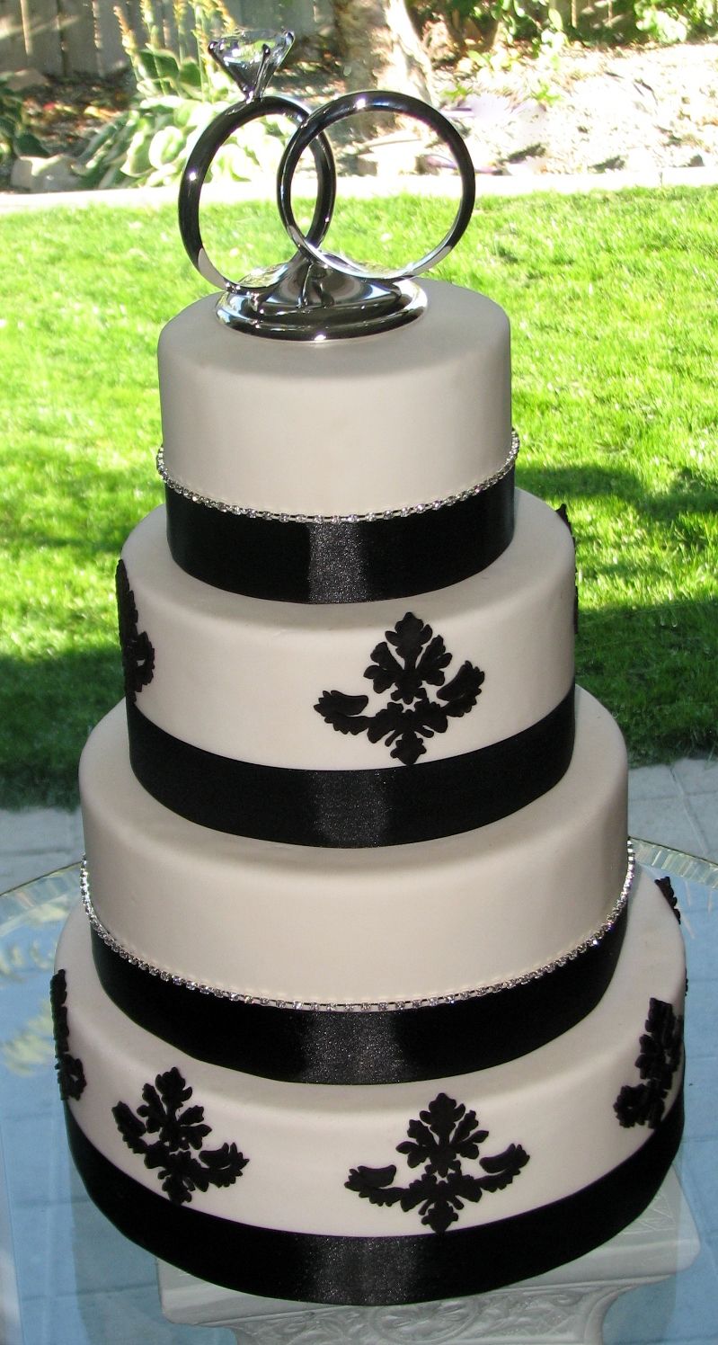 Tiered wedding cake with fondant design and diamon