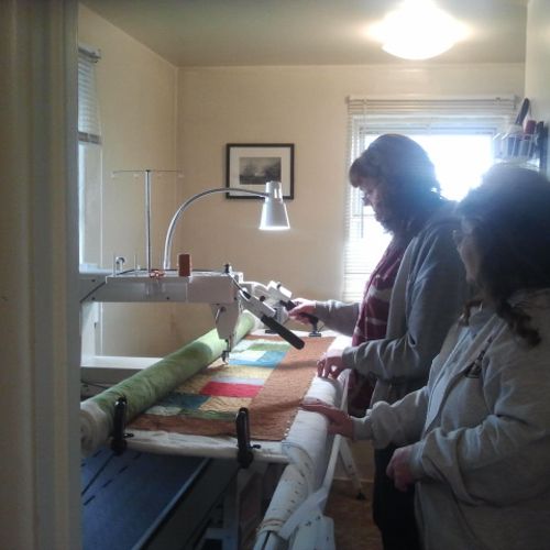 Ladies learning to use the Mega Quilter. Success!