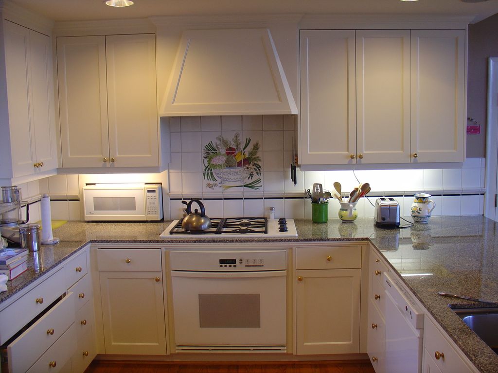 I hand-painted all of the cabinets in this kitchen