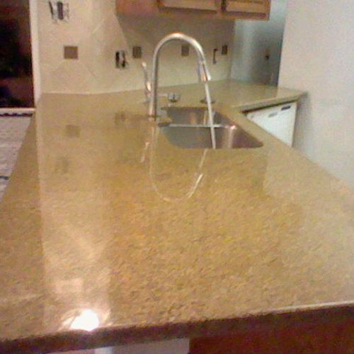Granite slab look in this kitchen gives it a richn