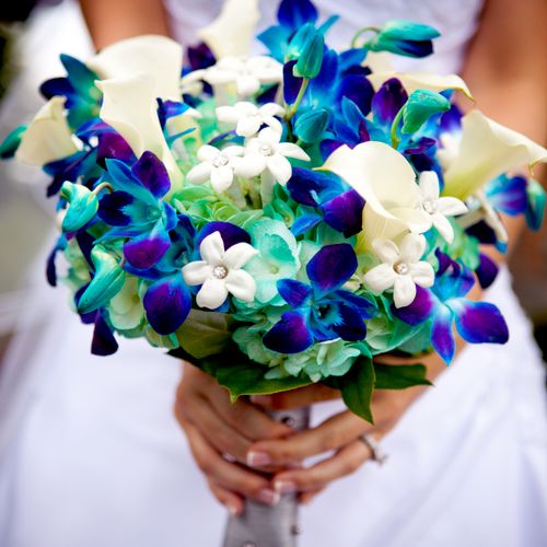 Brides bouquet with blue orchids, aqua hydrangeas,