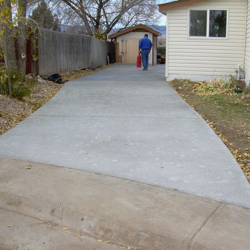 Regular grey concrete RV pad and driveway