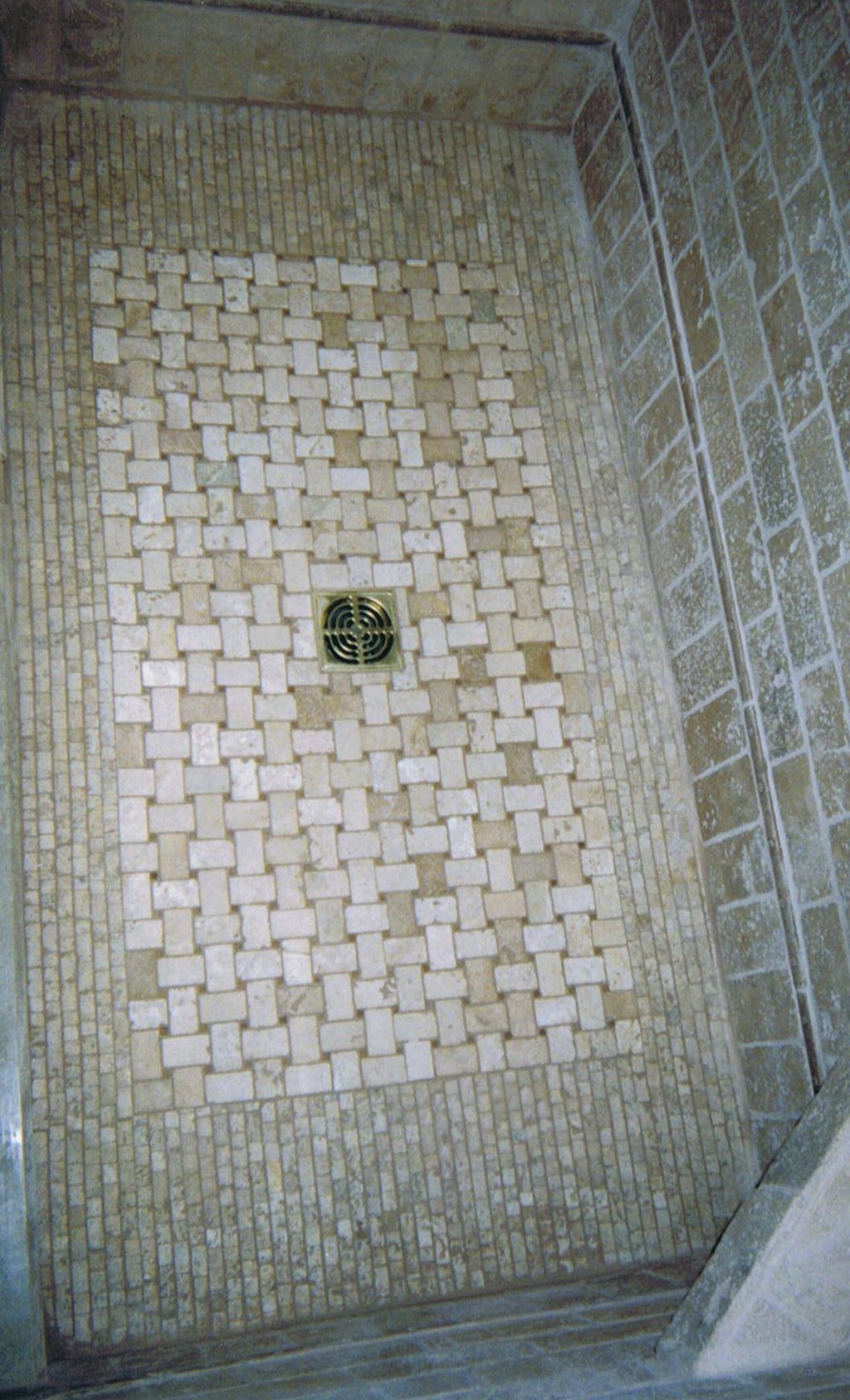 custom shower floor, mini brick mosaic surrounding