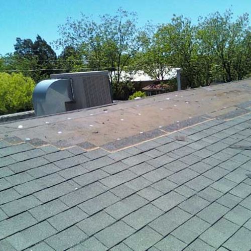 wind damaged roof before repair
