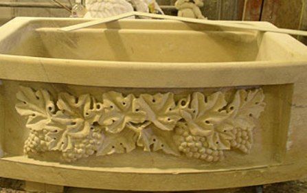 Hand carved sink out of a solid limestone block