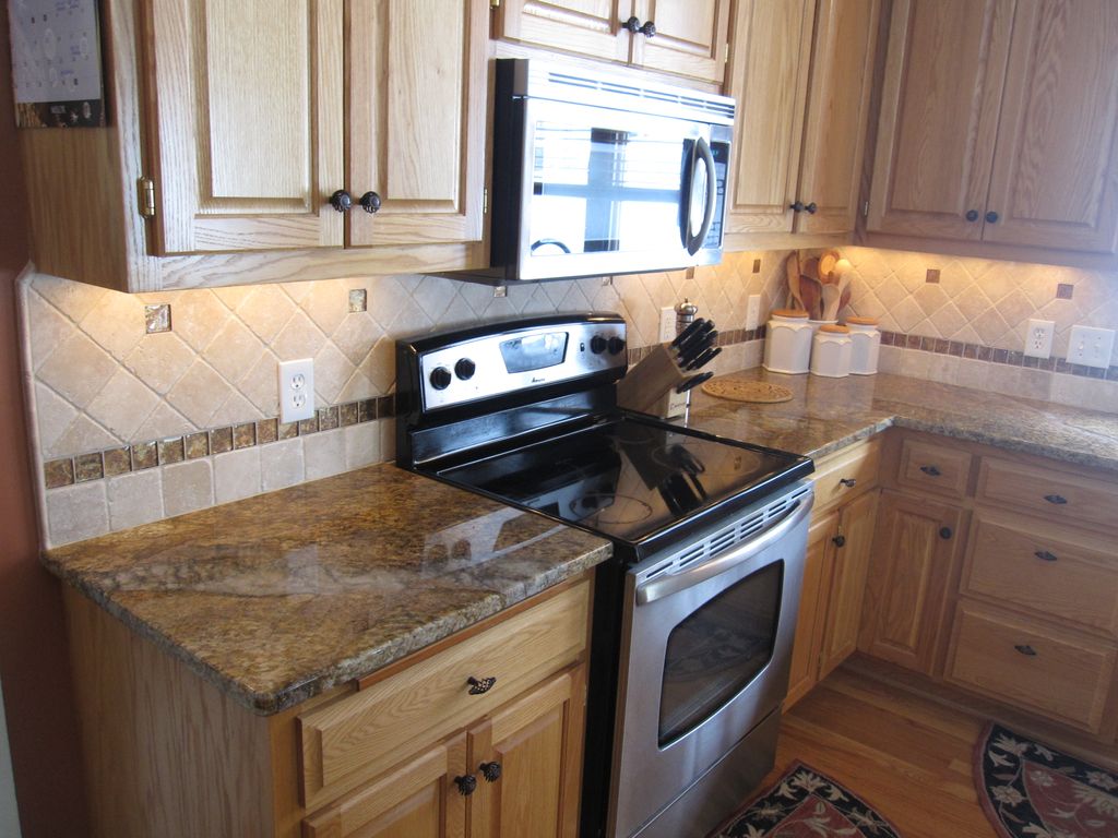 Stone Backsplash with Glass Inserts