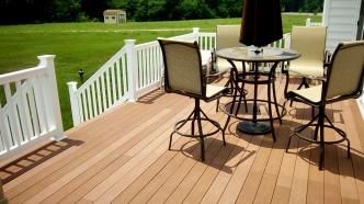 This is a custom composite deck with vinyl railing