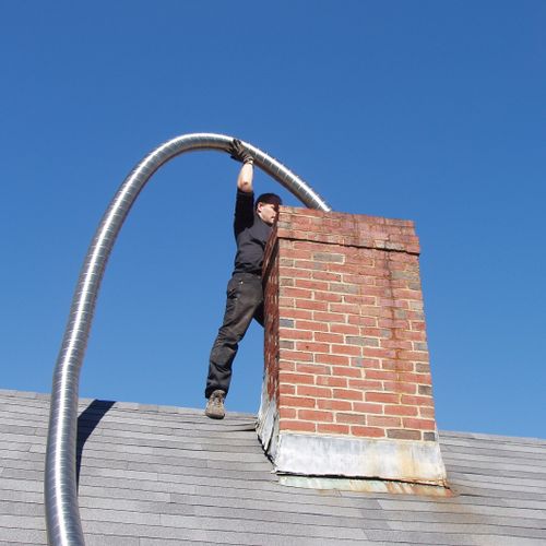 Installing a chimney liner.