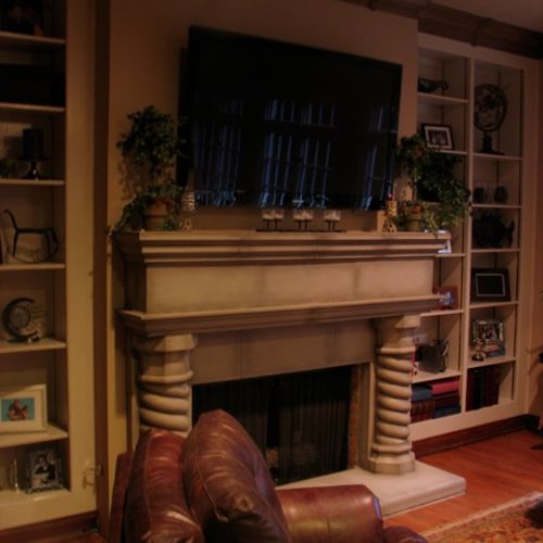 TV mounted above fireplace