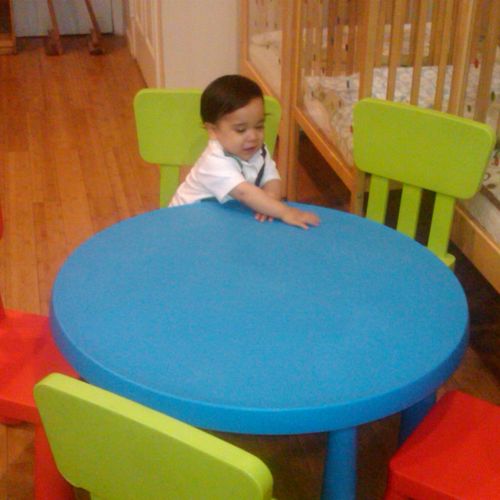 Baby Joseph sitting at table
