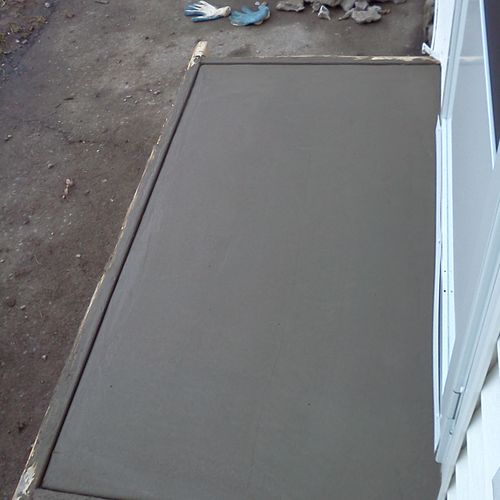 new concrete stoop still setting up in forms.