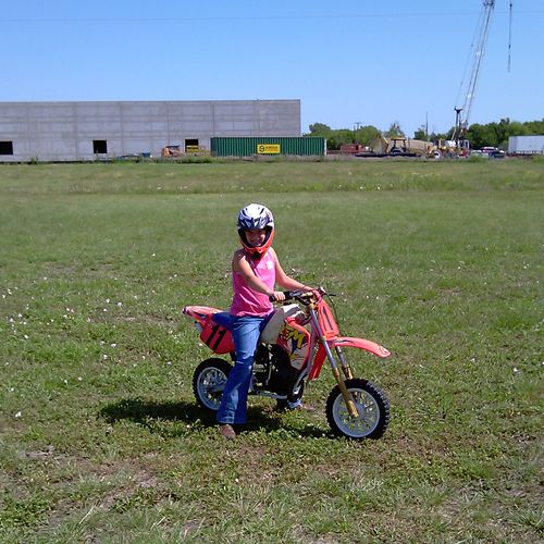 Scott's daughter riding her dirt bike.