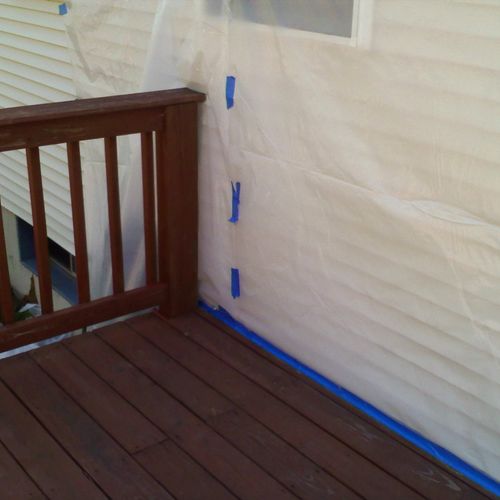 Plastic sheeting to protect home from paint spray