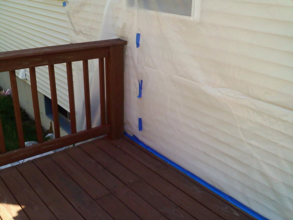Plastic sheeting to protect home from paint spray