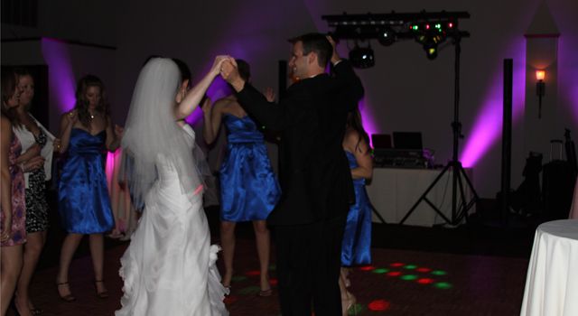 Bride and groom showing their moves on the dance f