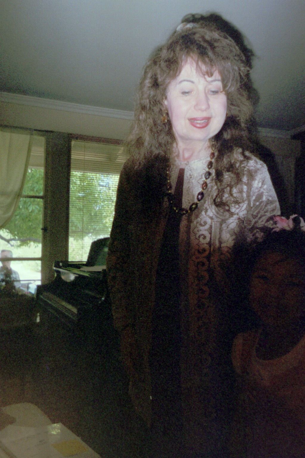 Anne and a young guest at a musicale