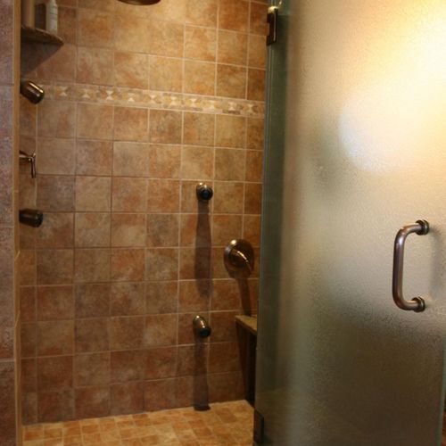 A comfortable shower - note the seat, body sprays 