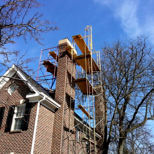 Masonry chimney rebuild and tuck pointing in progr