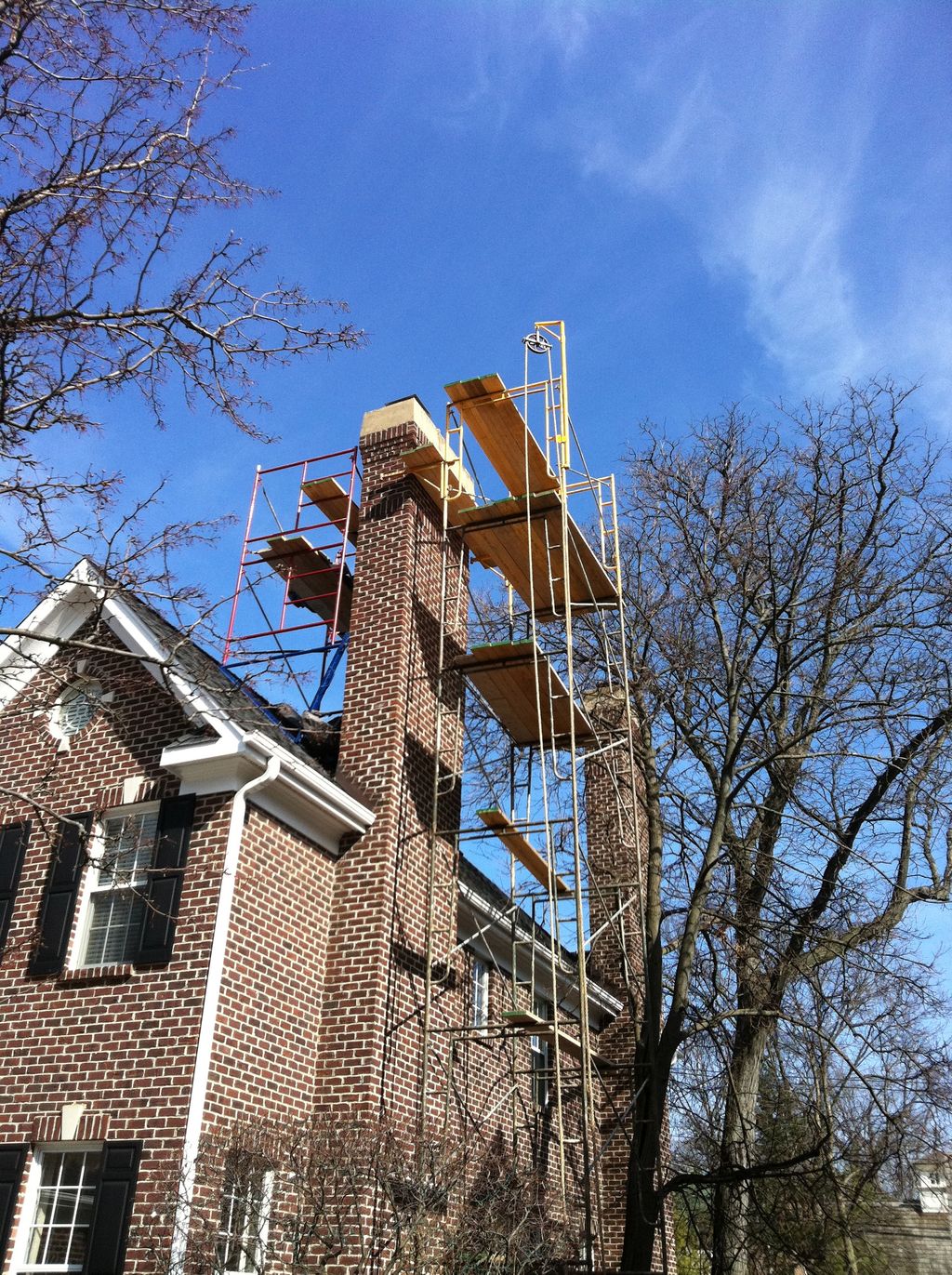 Masonry chimney rebuild and tuck pointing in progr