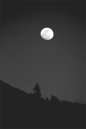 Digitally altered photo of moonrise over Aspen, Co