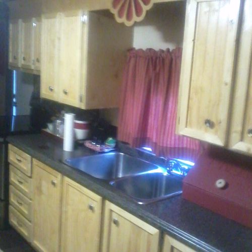 Hand-built kitchen cabinets and laminate counter t