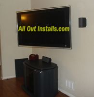 Flat Screen TV mounted on wall in corner with arm 