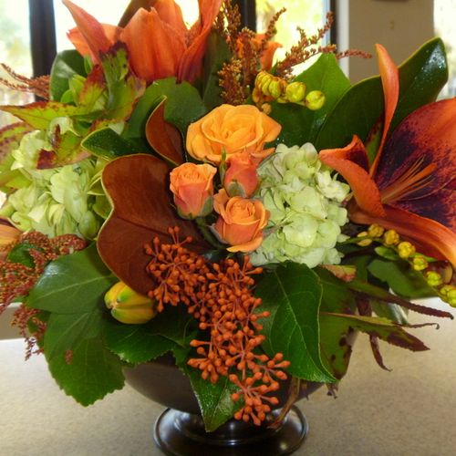 Fall-themed centerpieces used at a corporate event