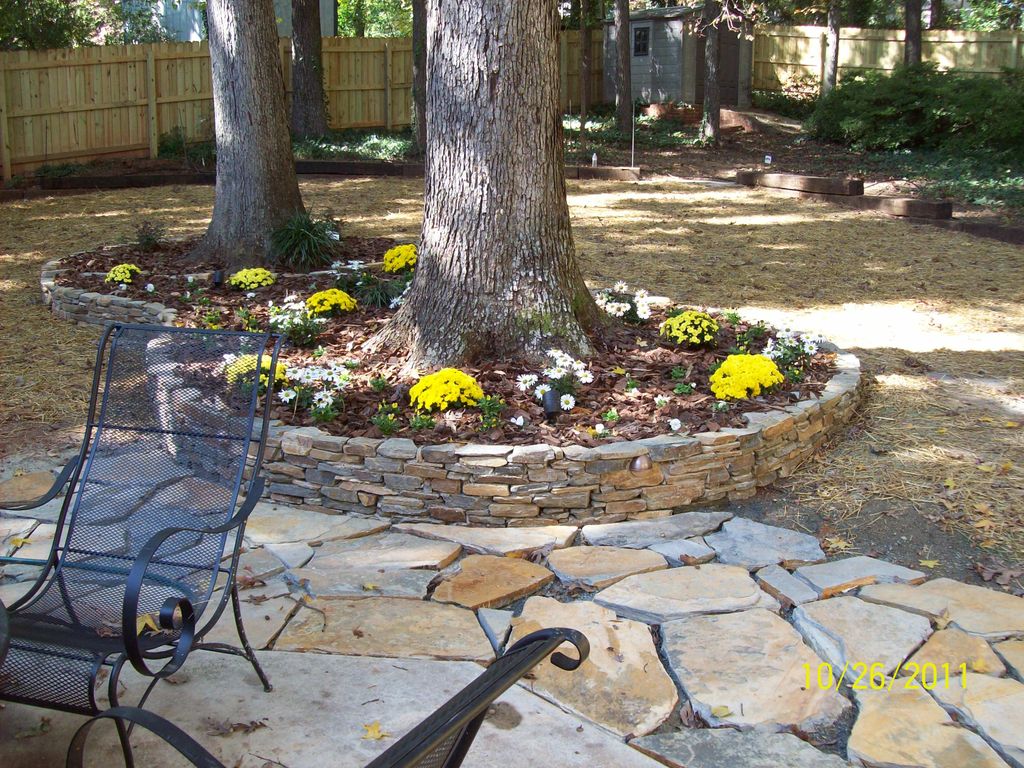 Extended concrete patio area with Flagstone. Regra