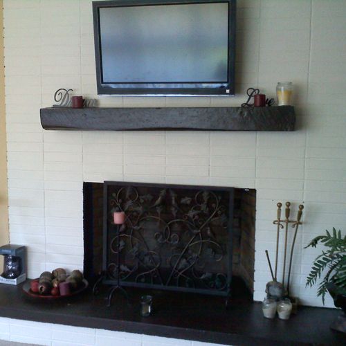 42 LCD mounted on the brick fireplace.