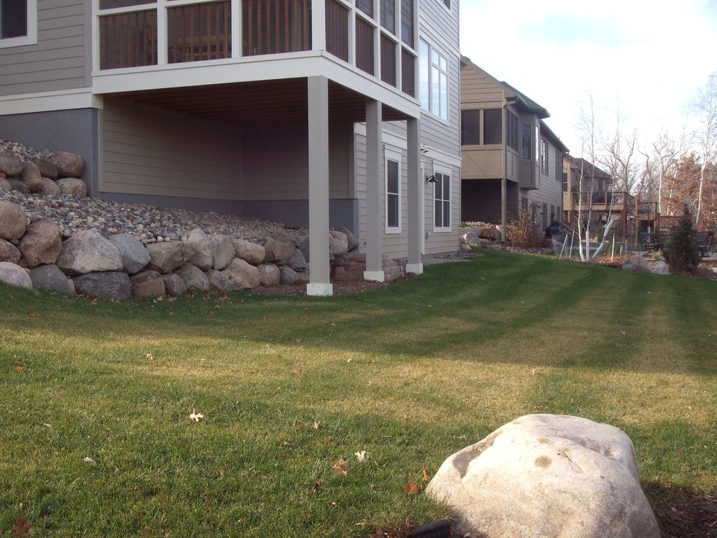 Boulder walls and sod.