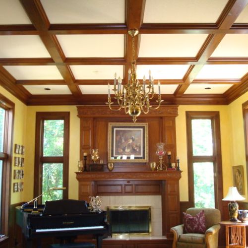 Stained all the wood beams on the ceiling, the man