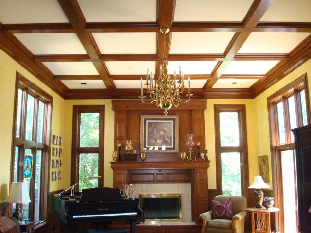 Stained all the wood beams on the ceiling, the man