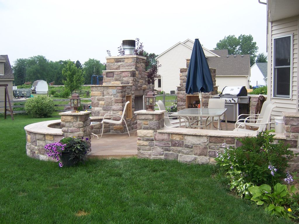 Masonry fireplace, seating walls, colored concrete